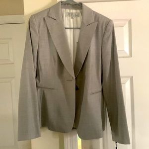 A gray blazer from Tahari. Brand new with tag still on it.